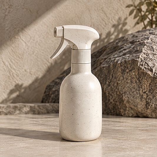 Hand operating the STONE sprayer with foam collecting on a surface