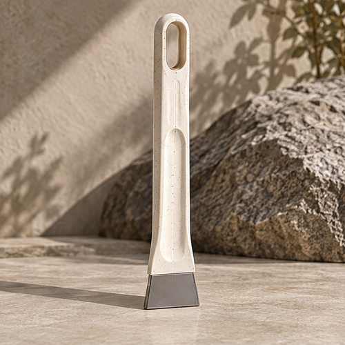 STONE flat scraping edge loosening dirt along a narrow floor junction