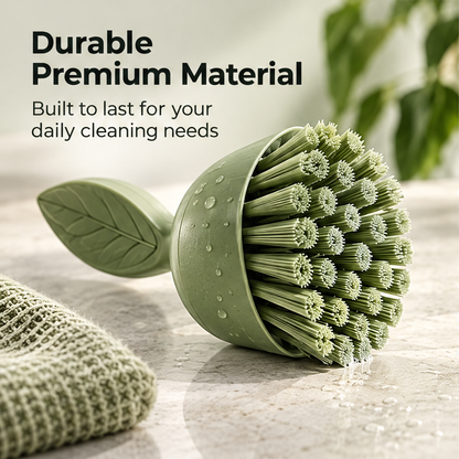 Hand using the NATURA leaf-grip scrubber to clean a sink