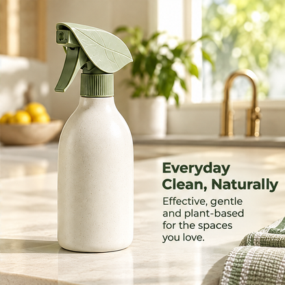 Hand operating the NATURA leaf-shaped cleaning spray trigger